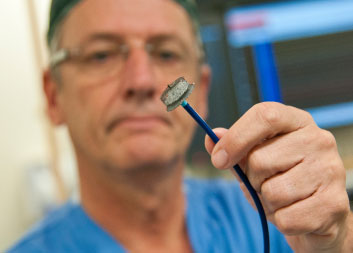 Dr. Jean-François Marquis, Heart Institute interventional cardiologist, holds a device used to prevent dangerous blood clots in the hearts of patients with atrial fibrillation (AF). For AF sufferers unable to take anti-clotting medication to prevent stroke, this device offers an alternative.