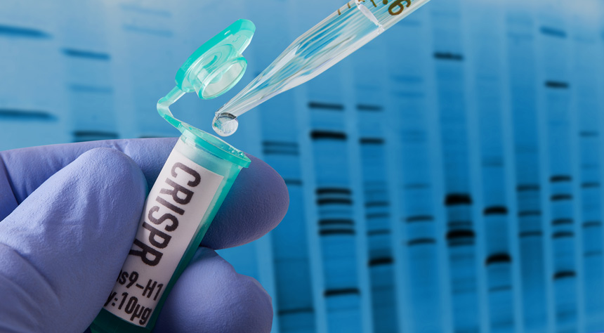 Hand holding vial doing CRISPR genomic research