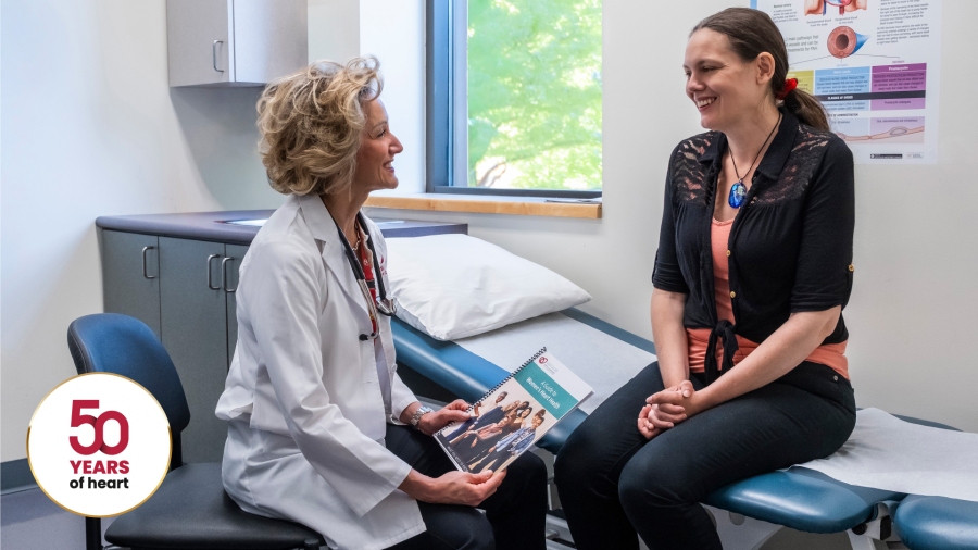A female doctor next to a female patient