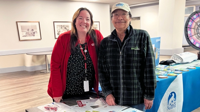 Julie Sawyer poses with a patient following an education session in Iqaluit