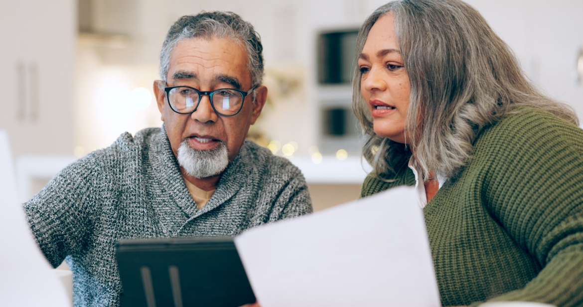 two people reading documents