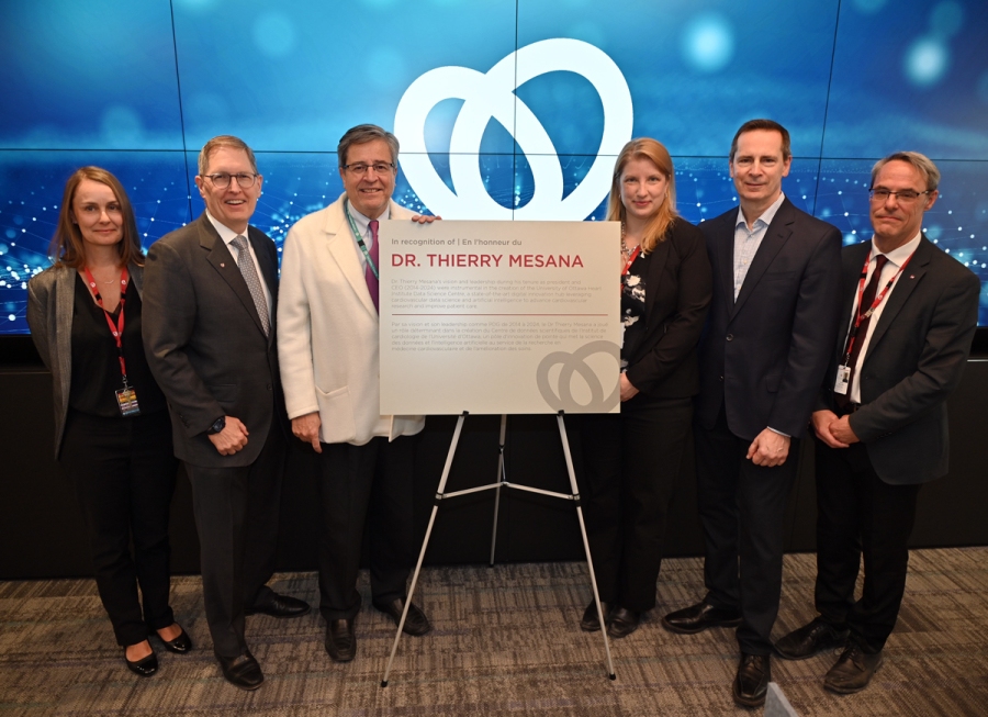 Dr. Thierry Mesana poses with a commemorative plaque recognizing his vision and leadership as instrumental in establishing the Data Science Centre at the University of Ottawa Heart Institute. From left to right: Bonnie Bowes, Dr. Rob Beanlands, Dr. Thierry Mesana, Jodi Edwards, Chairman of the UOHI Board of Directors Dalton McGuinty, and Timothy Zakutney.