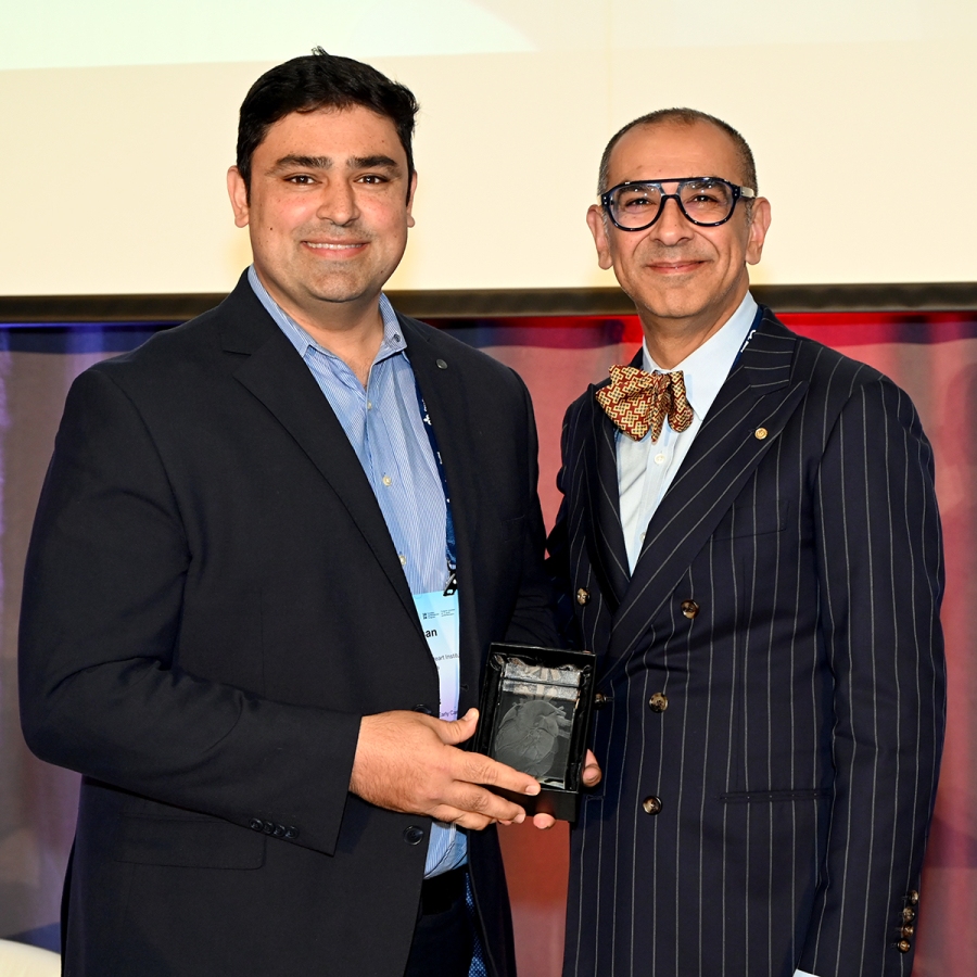 Dr. Hassan Mir accepts the Dr. Harold N. Segall Award of Merit from Canadian Cardiovascular Society President Dr. Sean Virani at the Canadian Cardiovascular Congress.