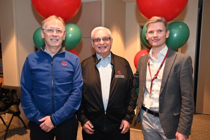 Dr. Martin Green is congratulated by Dr. David Birnie, head of the division of cardiology at the Ottawa Heart Institute (left), and cardiologist Dr. Simon Hansom.