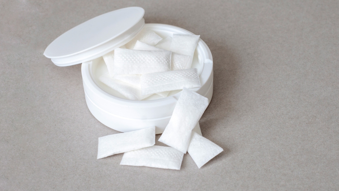 A container of nicotine pouches