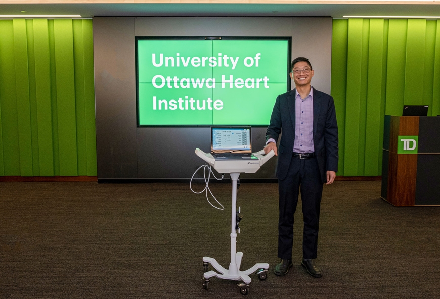 Dr. Benjamin Chow poses with a CAD-det test unit.