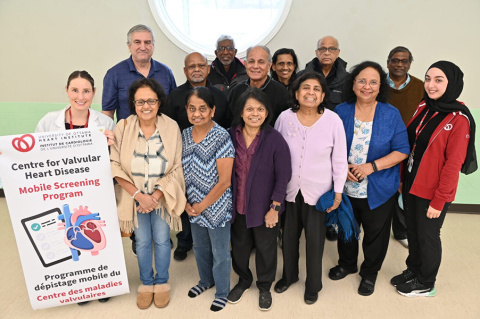 At a mobile screening clinic in Ottawa, staff of the Centre for Valvular Heart Disease pose with members of the Sri Lankan community.