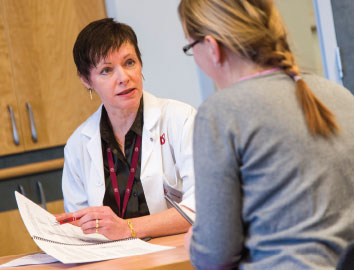 Photo of nurse consulting with a patient